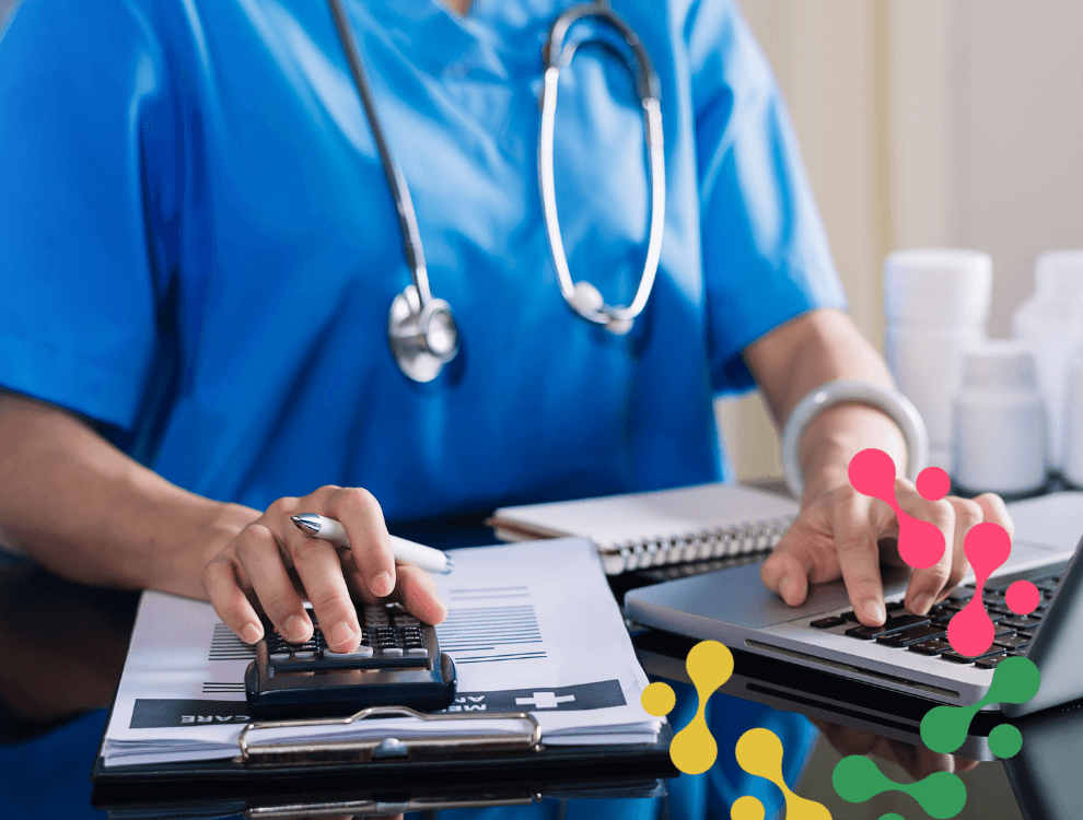 CSC2-ISO-22301-Business-Continuity-Management.1 a person in scrubs sitting at a desk with a laptop